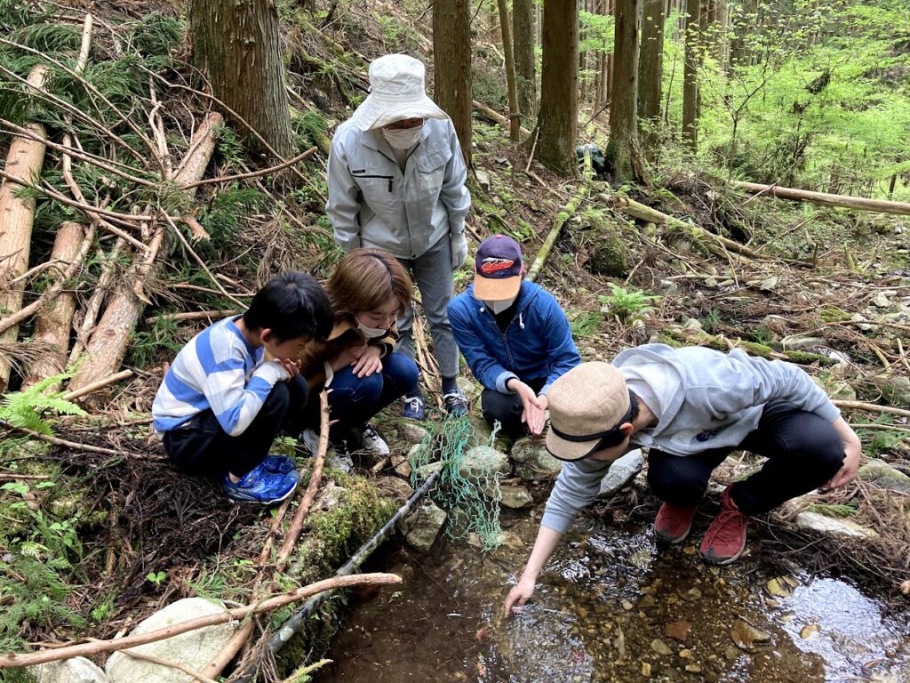 Students checking watersource up  in the mountain in Ena,GIFU
