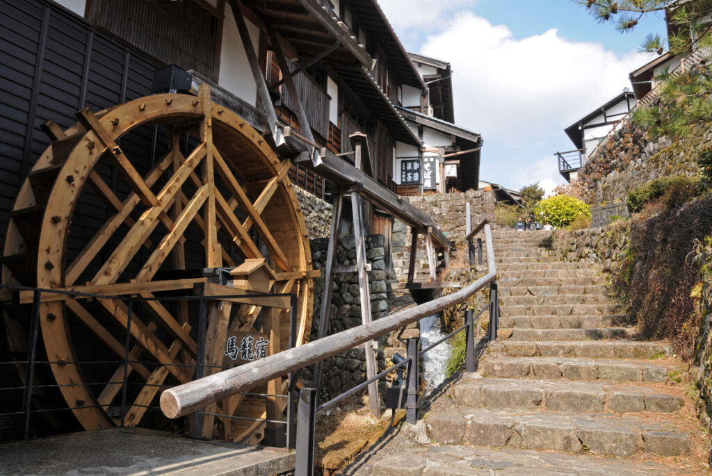 Landscape with waterwheel on the slope of Magome-juku, Nakasendo, Samurai Road, Nakatsugawa City