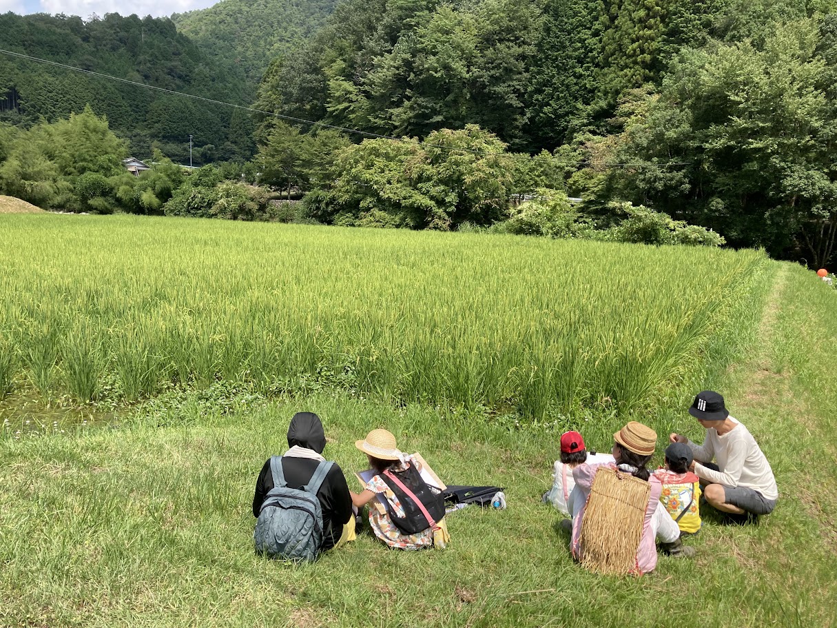 people having rests at the field in countryside of Ena,GIFU